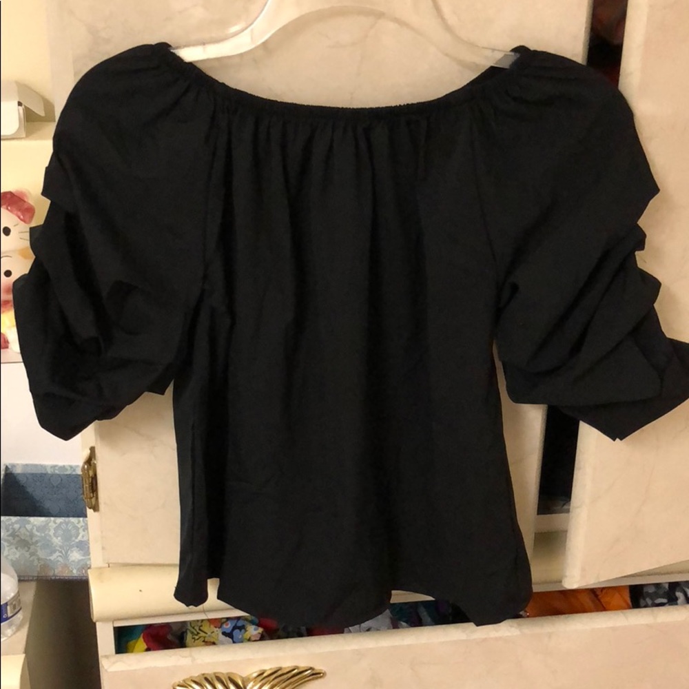 Off shoulder black ruffle sleeve top